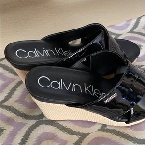 Black wedges by Calvin Klein